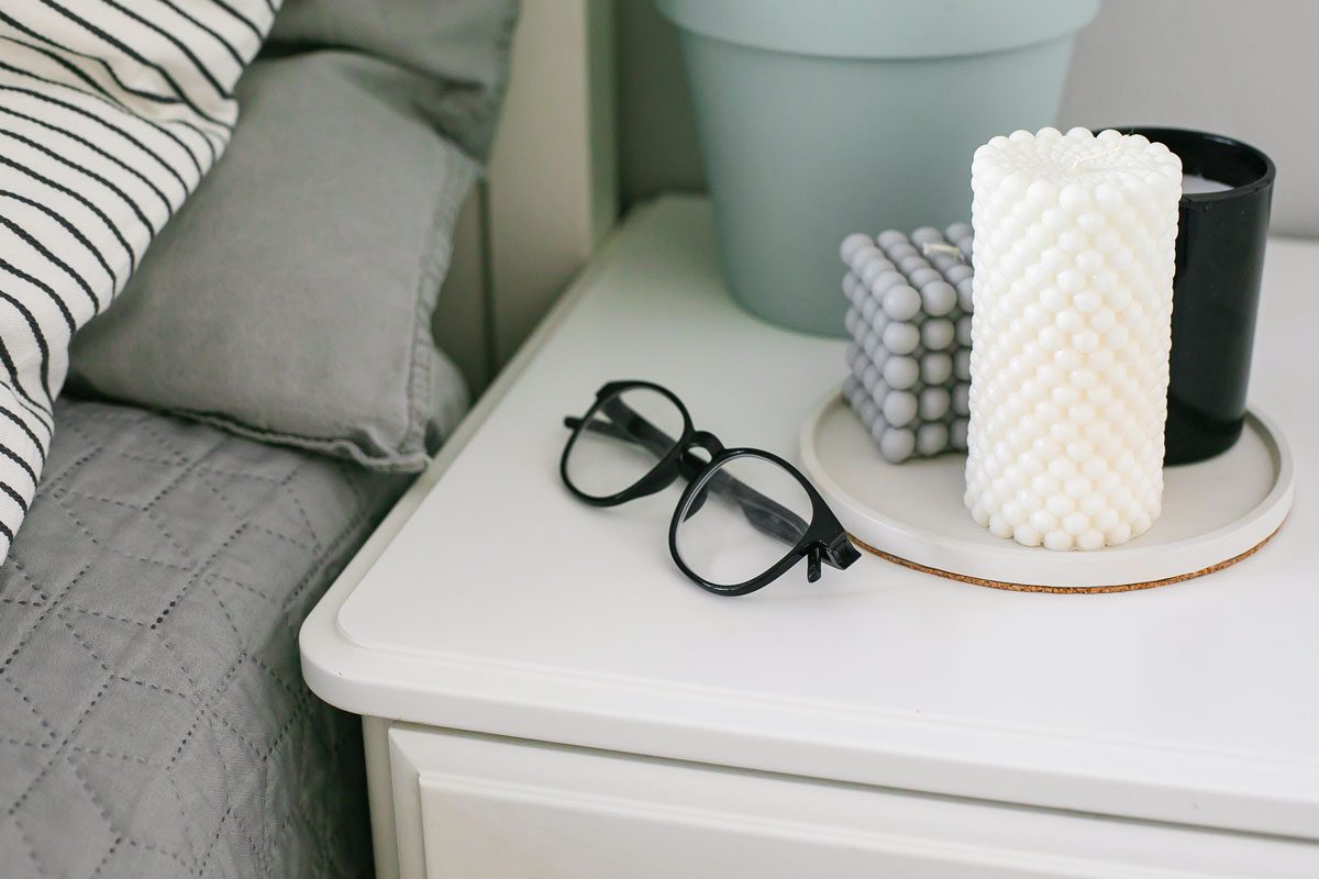 Nightstand With Home Plant Glasses And Candles