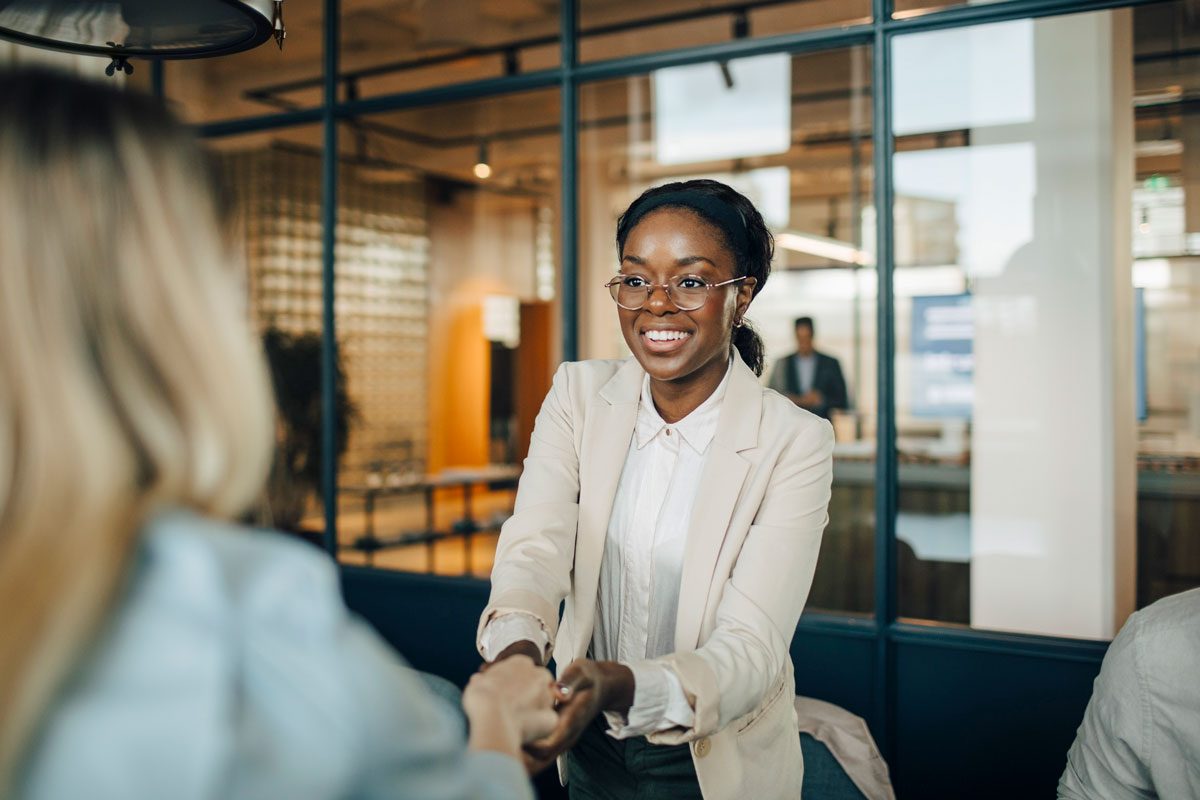 Smiling Female Shaking Hand